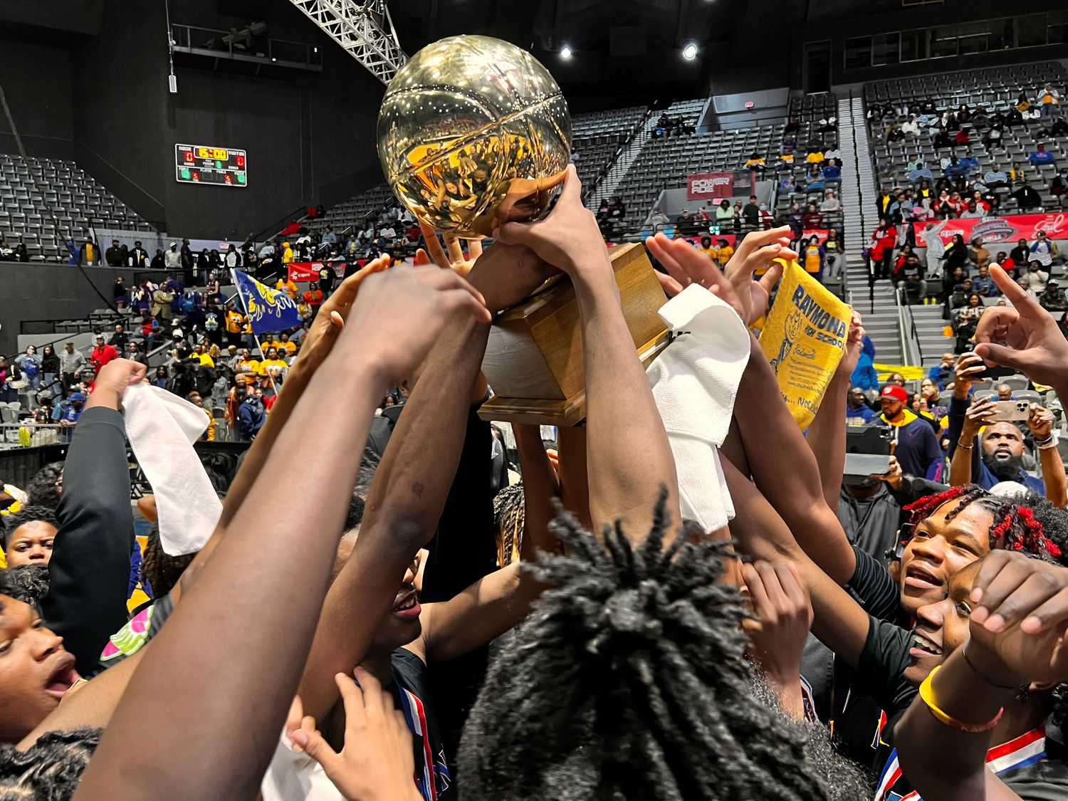 The Raymond Rangers hoist the MHSAA Class 4A State Championship Trophy after defeating McComb 53-28 on Saturday, March 2 at the Mississippi Coliseum in Jackson, Miss.